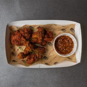 LOLLIPOP CHICKEN - spicy + crispy chicken wings served with Szechuan chutney